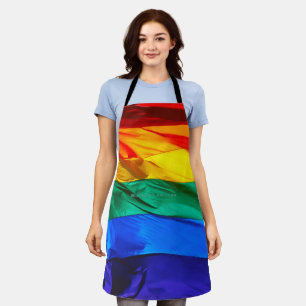 SlipperyJoe's gay pride flag waving red orange yel Apron
