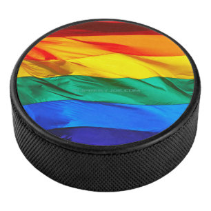SlipperyJoe's gay pride flag waving red orange yel Hockey Puck