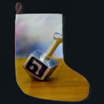 SlipperyJoe's Happy Hanukkah four-sided spinning t Small Christmas Stocking<br><div class="desc">SlipperyJoe's Happy Hanukkah four-sided spinning top dreidel artistic Celebration Candles Jewish Hebrew Chanukah gifts decorations Judaism religion Hebrew letter Nun traditional toy children adult game cultural symbol metallic shiny finish wooden surface</div>