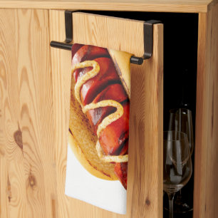 SlipperyJoe's hot dog nestled soft bun vibrant yel Tea Towel