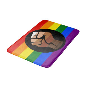 SlipperyJoe's queer people colour flag raised fist Bath Mat