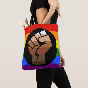 SlipperyJoe's queer people colour flag raised fist Tote Bag