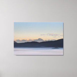 Slovenian mountains and morning fog in valley canvas print