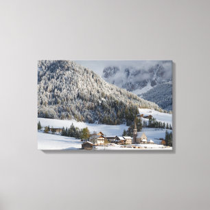 Small alpine village in the snow canvas print