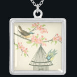 Small Birds Perched on a Branch and on a Birdcage Silver Plated Necklace<br><div class="desc">Nancy Slocum's have painted many birds throughout the years. This image portrays two small blue and yellow birds perched on a branch surrounded by pink flowers and looking curious about a birdcage. Get this cool bird-themed art piece on your Zazzle product today.</div>