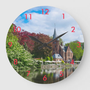 Small castle near lake in Bruges, Belgium Large Clock