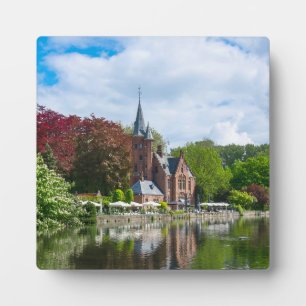 Small castle near lake in Bruges, Belgium Plaque