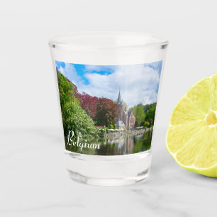 Small castle near lake in Bruges, Belgium Shot Glass