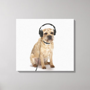 Small dog wearing headphones canvas print