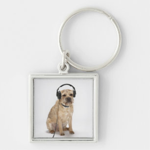 Small dog wearing headphones key ring
