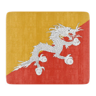 Small glass cutting board with flag of Bhutan