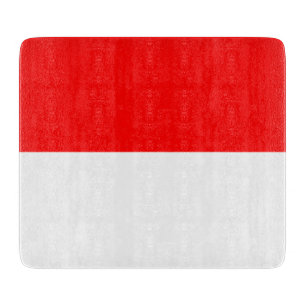 Small glass cutting board with flag of Indonesia