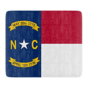 Small glass cutting board with North Carolina flag
