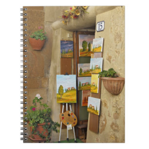 Small shope with artwork for sale on sidewalk notebook
