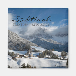 Small village with Dolomites mountains in the snow Magnet