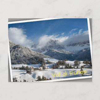 Small village with Dolomites mountains in the snow Postcard