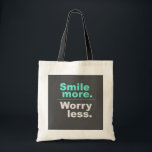 Smile More, Worry Less Tote Bag - Spread Positivit<br><div class="desc">Brighten up your day with this uplifting tote bag featuring the inspiring phrase 'Smile more. Worry less.' Made from high-quality materials,  this tote bag is perfect for daily use,  shopping,  or as a gift for friends and family who appreciate a positive message."</div>