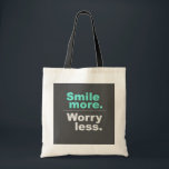 Smile More, Worry Less Tote Bag - Spread Positivit<br><div class="desc">Brighten up your day with this uplifting tote bag featuring the inspiring phrase 'Smile more. Worry less.' Made from high-quality materials,  this tote bag is perfect for daily use,  shopping,  or as a gift for friends and family who appreciate a positive message."</div>