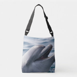 Smiling Dolphin Lifting Above Blue Water Crossbody Bag