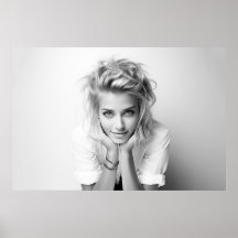 Smiling woman with her head in her hands B&W photo