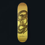 Snakes Personalised Faux Gold Foil Skateboard<br><div class="desc">A unique skateboard featuring two snakes entangled and your name personalised in a script signature on a faux gold foil background. eye catching and bold.</div>