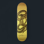 Snakes Personalised Faux Gold Foil Skateboard<br><div class="desc">A unique skateboard featuring two snakes entangled and your name personalised in a script signature on a faux gold foil background. eye catching and bold.</div>