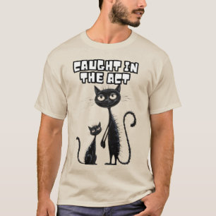 Sneaky Smiles: Black Kitten with Her Playful Compa T-Shirt