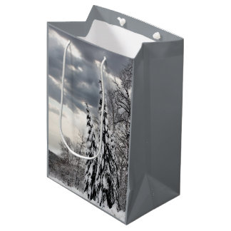 Snow-Covered Evergreen Trees Under Dramatic Winter Medium Gift Bag