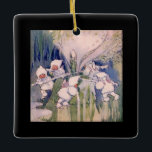 Snow Faeries Making Snow Ceramic Ornament<br><div class="desc">vintage fairylands painting of snow fairies making snow dressed in white fluffy hooded coats, pretty pink wings and fur lined trousers working and pushing snow covers sticks around a snow mill to churn and make snow. vintage illustrative watercolor fairyland painting of fairies on top of a mountain manufacturing snow by...</div>