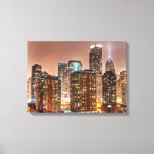 Snow falls over skyline at evening in Chicago Canvas Print