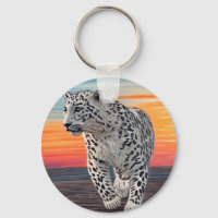Snow Leopard Walking on the Beach During a Sunset