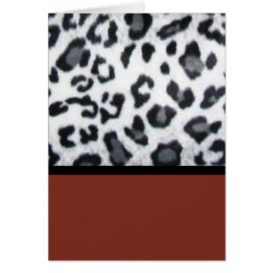 snow leopard with red