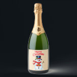 Snow man hat Christmas hat Sparkling Wine Label<br><div class="desc">This charming snowman, with his radiant smile and carrot nose, is ready for the end of the year celebrations! He wears a top hat decorated with swell, a warm red scarf, and holds a gift with a ribbon in his hands. Around him, stars and the text "Merry Christmas" add a...</div>