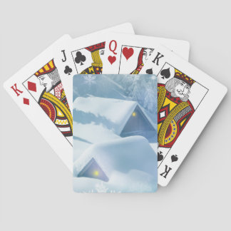 Snow topped roof in a forest playing cards