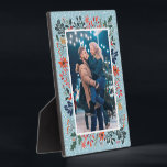 Snow Winter Floral Christmas Photo Plaque<br><div class="desc">Tabletop built-in photo easel features your favorite photo surrounded by snow and winter flowers - poinsettias, berries and leaves - on ANY COLOR BACKGROUND (we show blue.) Change the YEAR (in the lower right corner) or it can be deleted. Great as a gift or to display your favorite photo in...</div>