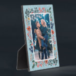Snow Winter Floral Christmas Photo Plaque<br><div class="desc">Tabletop built-in photo easel features your favorite photo surrounded by snow and winter flowers - poinsettias, berries and leaves - on ANY COLOR BACKGROUND (we show blue.) Change the YEAR (in the lower right corner) or it can be deleted. Great as a gift or to display your favorite photo in...</div>