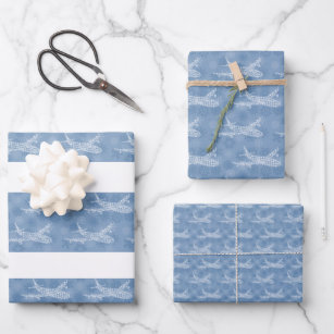 Snowflake Aeroplane on blue. Wrapping Paper Sheets