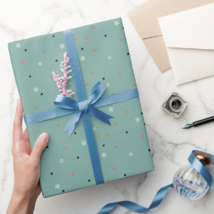Snowflakes and dots on turquoise wrapping paper