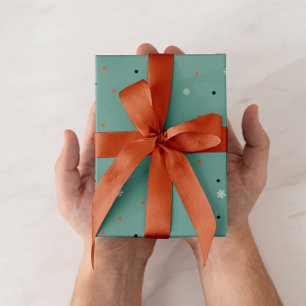 Snowflakes and dots on turquoise wrapping paper