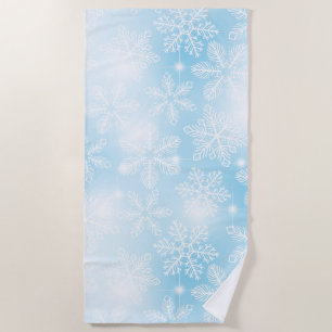 Snowflakes and lights on blue beach towel