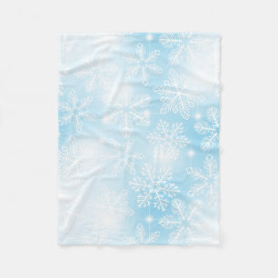 Snowflakes and lights on blue fleece blanket