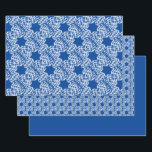 Snowflakes and Stars Wrapping Paper Sheet<br><div class="desc">Holiday gift wrap featuring snowflakes and stars on blue.</div>