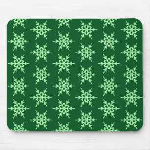 Snowflakes, pale green crystals on dark green mouse pad