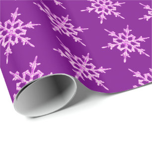 Snowflakes, pale orchid crystals on purple wrapping paper