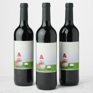 Snowman and golf ball on green grass Christmas Wine Label