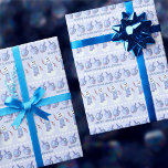 Snowman Dreidels Cute Personalised Happy Hanukkah Wrapping Paper<br><div class="desc">This cute personalised Happy Hanukkah wrapping paper in soft blues and white with snowmen and dreidels will delight kids and adults alike. Rows of happy little Jewish snowmen and tilted dreidels on a soft pastel blue background are accented with rows of white dots and your custom text in a simple...</div>
