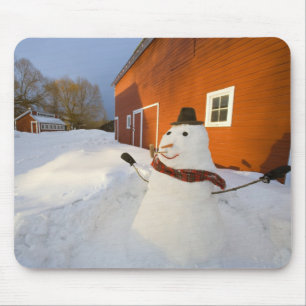 Snowman in front of red barn in Columbia Falls Mouse Pad