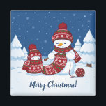 Snowman Knitting Christmas Scarf Magnet<br><div class="desc">Cartoon illustration of two adorable snowmen dressed in knitted hats and scarves. The big snowman is knitting an oversized scarf for the little one. The scarf is already wrapped several times around the cute little snowman.</div>
