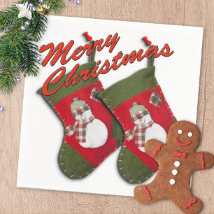 Snowman on Christmas Stocking Over White Napkin