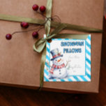 Snowman Pillows Christmas Gift Tag naughty elf<br><div class="desc">Snowman Pillows Christmas Gift Tag Add festive charm to your holiday gifts with this cute watercolour snowman gift tag featuring the words “Snowman Pillows” on a snowy blue striped background. Perfect for Christmas Eve boxes, naughty Elf surprises, stocking fillers, or marshmallow and hot chocolate themed presents, this fun design brings...</div>